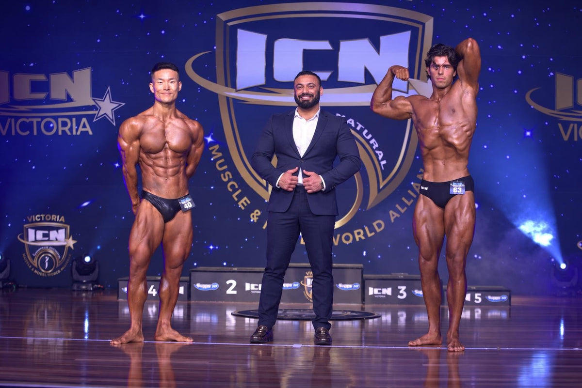 Supps247 owner Gagandeep Bajwa on stage with natural bodybuilding competitors at ICN Victoria 2026